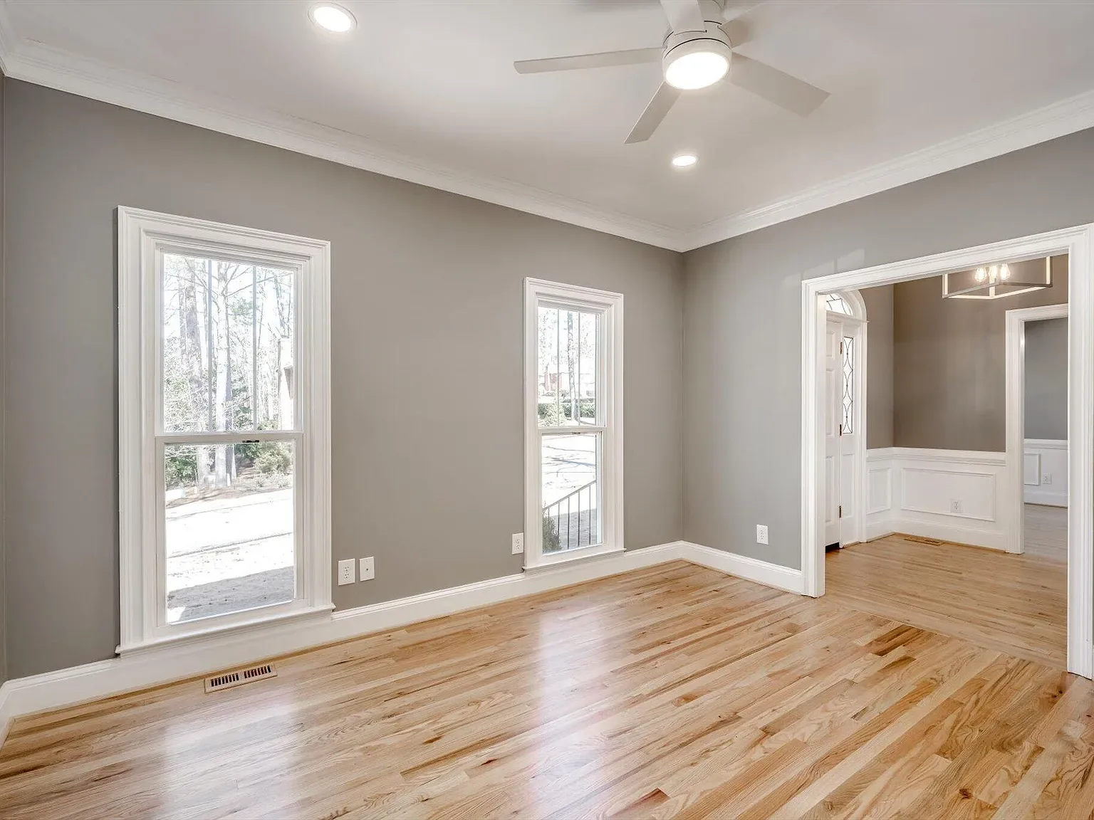 Living room with refinished hardwood floors at 2 Shadowmoor Court