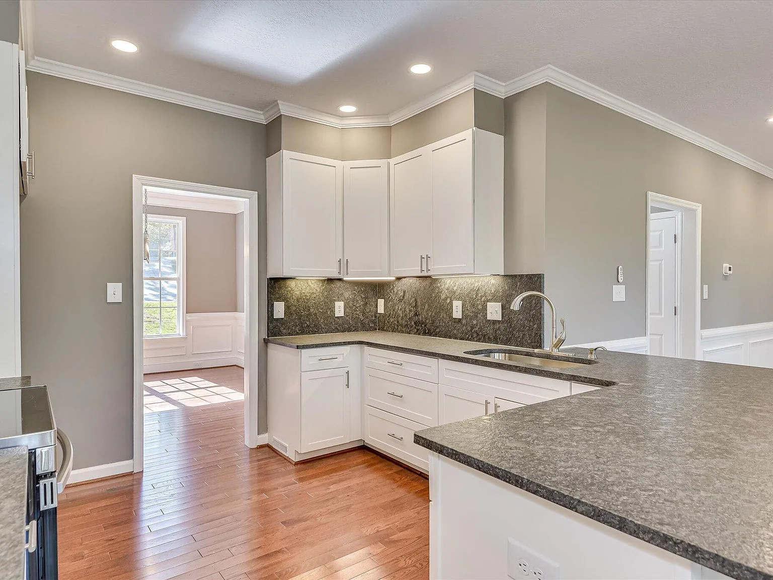 Kitchen with granite counters and stainless appliances at 2008 Rivershyre Drive
