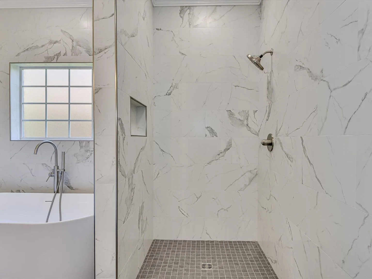 Primary bath freestanding soaking tub with wall-mount faucet at 2008 Rivershyre Drive