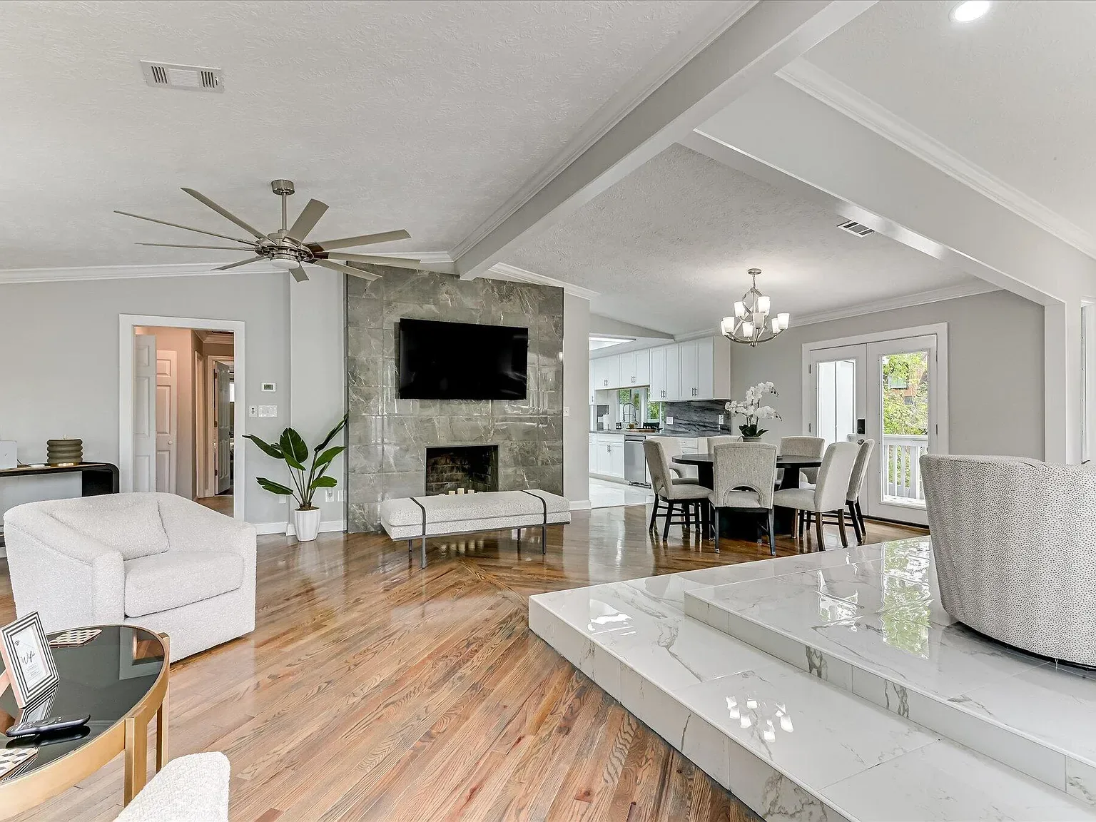 Living room with fireplace after a full-home renovation at 2417 Wilkshire Drive