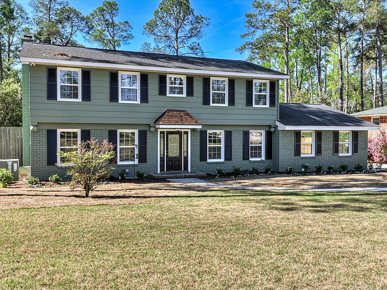 Front elevation after new siding, trim and windows at 814 Dunbarton Drive