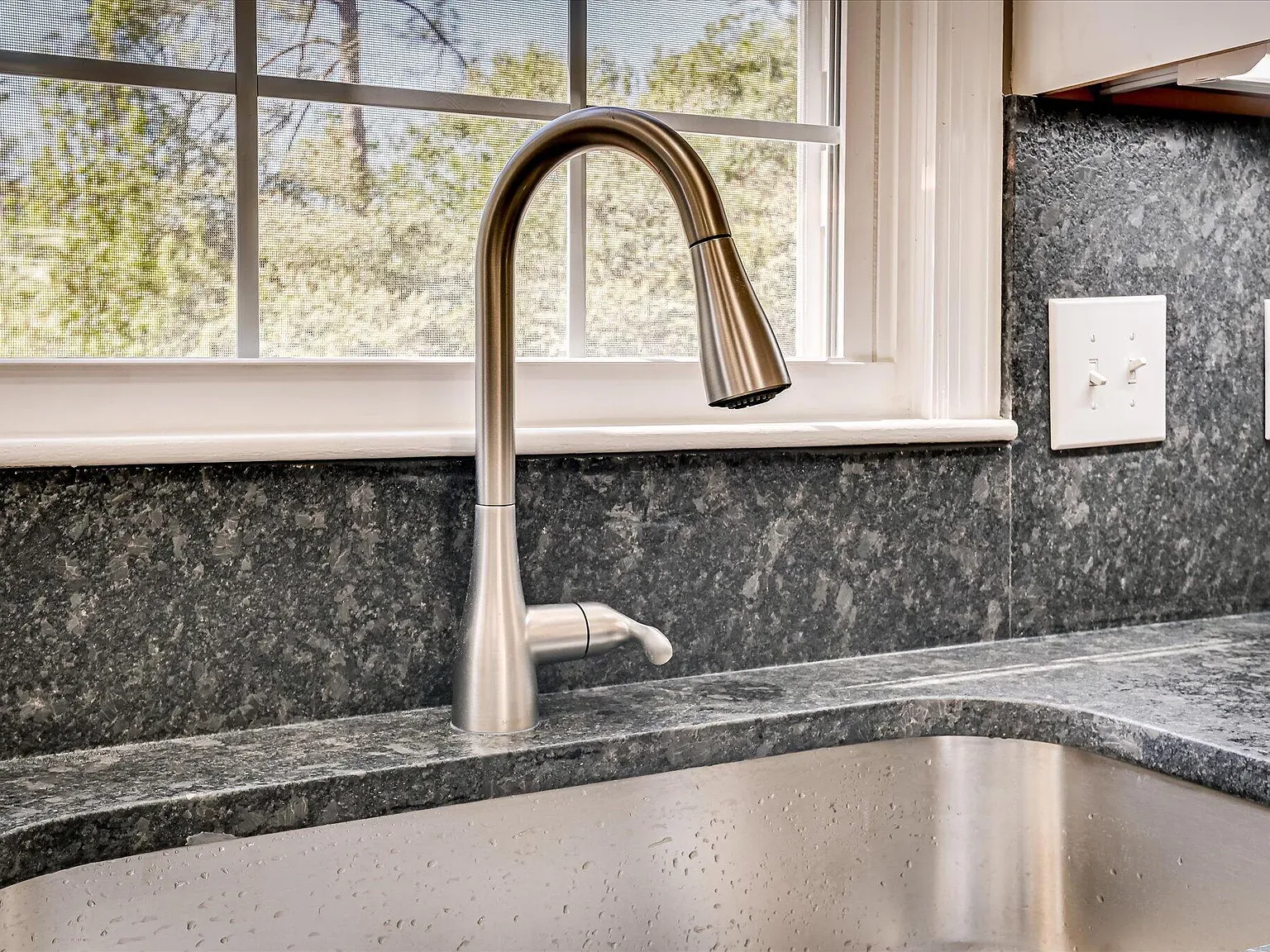 Granite counter, undermount sink and new pull-down faucet at 814 Dunbarton Drive