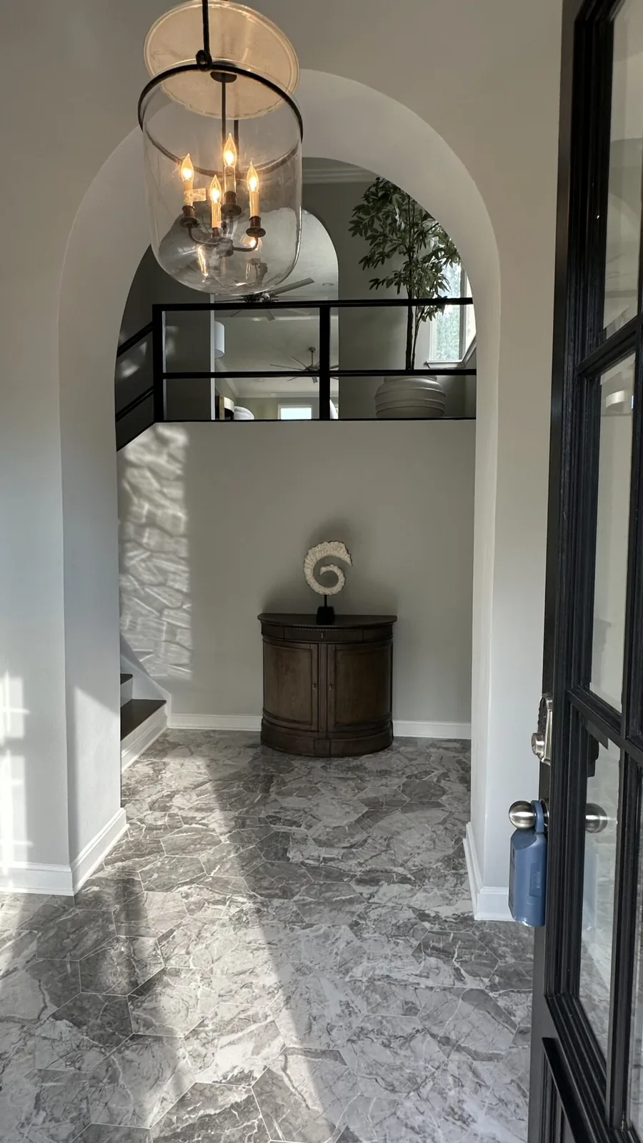 Entry foyer with new flooring and trim at 2417 Wilkshire Drive